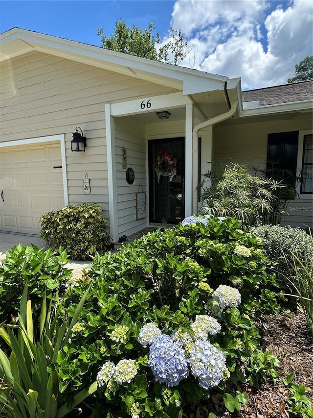 doorway to property featuring a garage