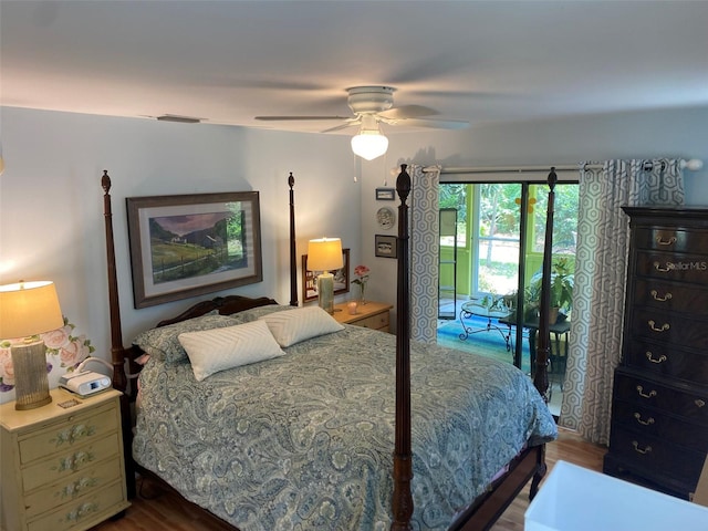 bedroom with access to exterior, wood finished floors, and a ceiling fan