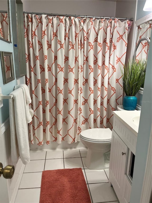 66 Elmwood Trl, Deland, FL 32724 - full bathroom featuring toilet, vanity, tile patterned floors, and shower / bath combo with shower curtain