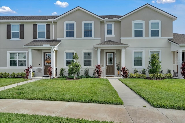 2552 Chickasaw Plum Loop, Clermont, FL 34711 - view of property featuring a front yard and stucco siding