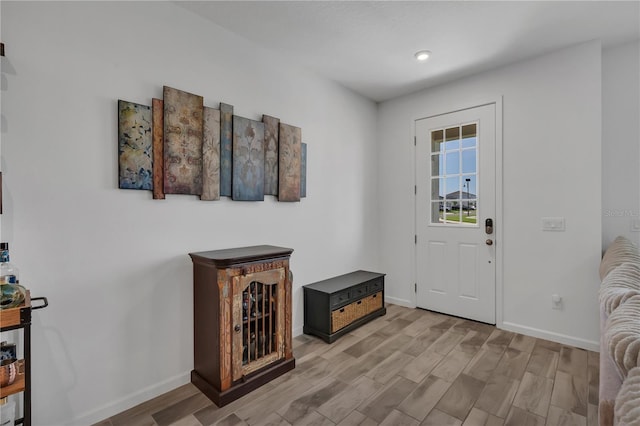 2552 Chickasaw Plum Loop, Clermont, FL 34711 - foyer entrance with baseboards, light wood-style floors, and recessed lighting