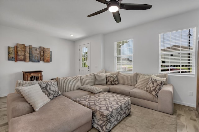2552 Chickasaw Plum Loop, Clermont, FL 34711 - living area with wood finished floors, baseboards, and ceiling fan
