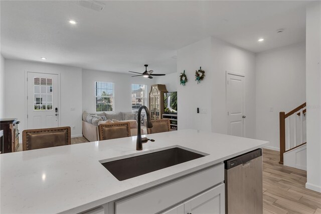 2552 Chickasaw Plum Loop, Clermont, FL 34711 - kitchen featuring dishwasher, a sink, white cabinets, recessed lighting, and light wood finished floors
