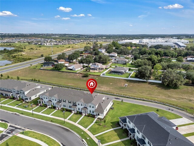 2552 Chickasaw Plum Loop, Clermont, FL 34711 - aerial perspective of suburban area with a nearby body of water