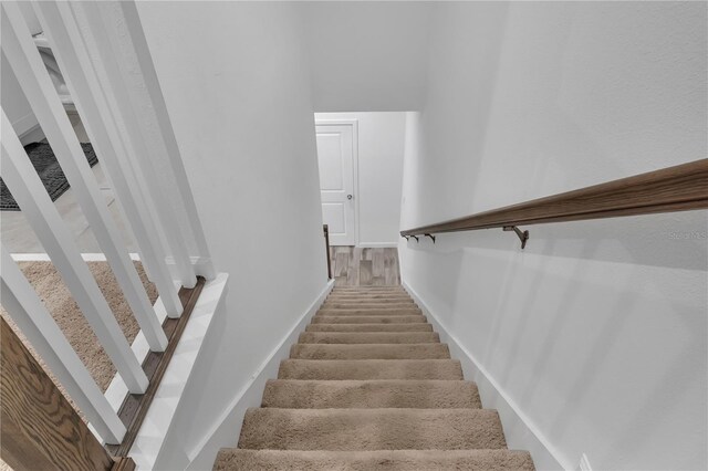 2552 Chickasaw Plum Loop, Clermont, FL 34711 - staircase featuring baseboards