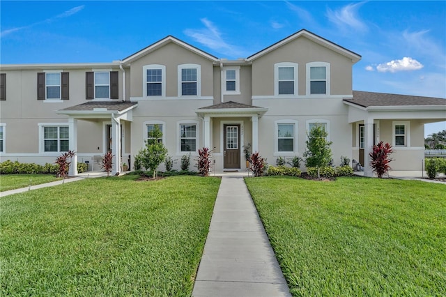 2552 Chickasaw Plum Loop, Clermont, FL 34711 - view of property with a front lawn and stucco siding