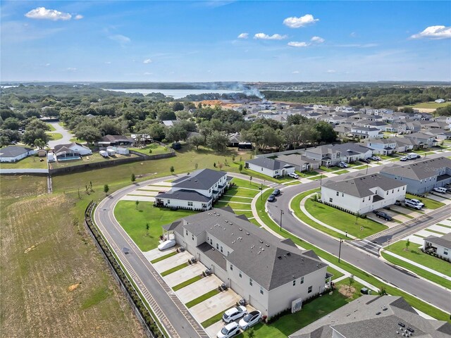 2552 Chickasaw Plum Loop, Clermont, FL 34711 - aerial perspective of suburban area with a large body of water