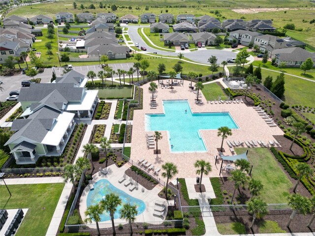 2552 Chickasaw Plum Loop, Clermont, FL 34711 - aerial perspective of suburban area with a pool area