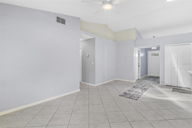 26608 Racquet Cir, Leesburg, FL 34748 - unfurnished room with a ceiling fan, light tile patterned floors, vaulted ceiling, and baseboards
