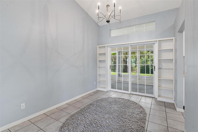 26608 Racquet Cir, Leesburg, FL 34748 - spare room featuring high vaulted ceiling, tile patterned floors, a chandelier, and baseboards