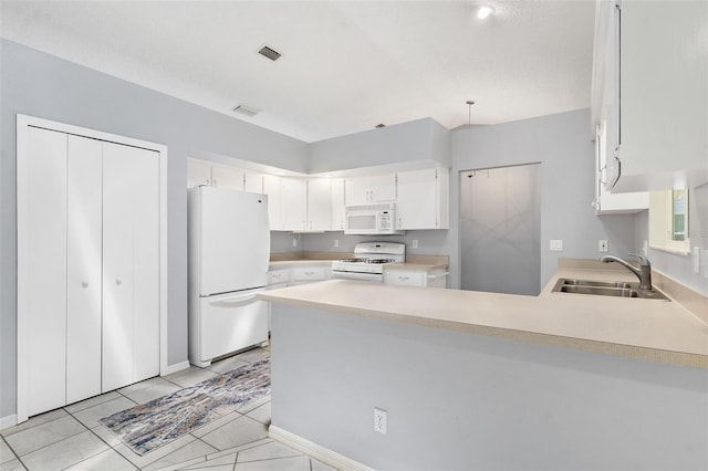 26608 Racquet Cir, Leesburg, FL 34748 - kitchen with white appliances, a sink, a peninsula, light countertops, and white cabinetry