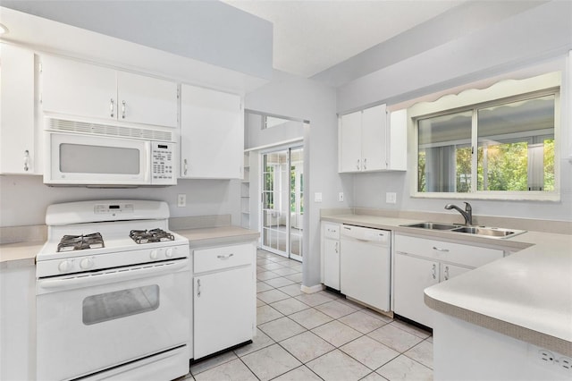 26608 Racquet Cir, Leesburg, FL 34748 - kitchen featuring white appliances, a sink, light countertops, white cabinets, and light tile patterned floors