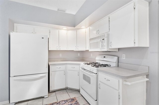 26608 Racquet Cir, Leesburg, FL 34748 - kitchen with white appliances, light countertops, and white cabinets