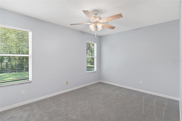26608 Racquet Cir, Leesburg, FL 34748 - carpeted spare room featuring ceiling fan, baseboards, and a textured ceiling