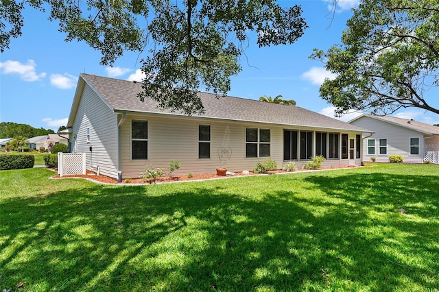 26608 Racquet Cir, Leesburg, FL 34748 - back of house with a yard, a shingled roof, and a sunroom