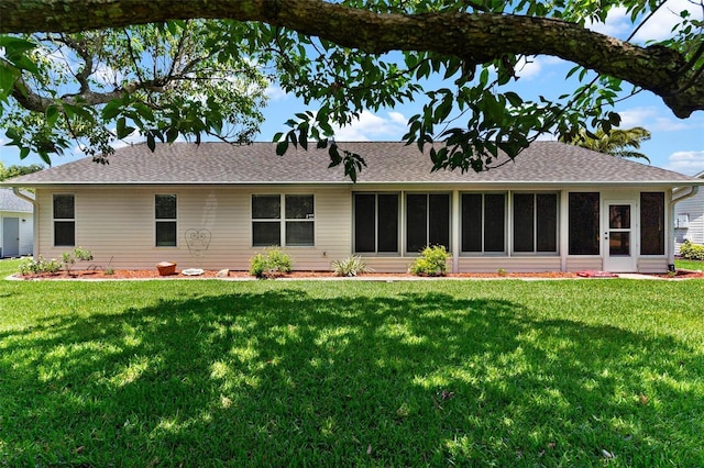 26608 Racquet Cir, Leesburg, FL 34748 - rear view of property featuring a yard, a shingled roof, and a sunroom