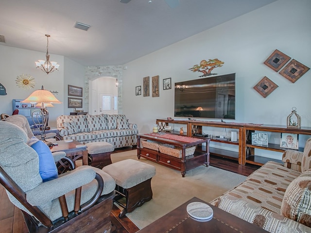 3136 Vandenberg Ct, The Villages, FL 32163 - living area featuring arched walkways and a chandelier