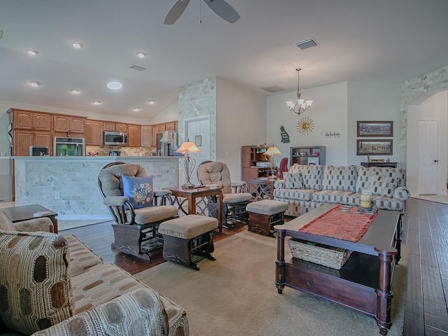3136 Vandenberg Ct, The Villages, FL 32163 - living area featuring a ceiling fan, arched walkways, wood finished floors, lofted ceiling, and a chandelier