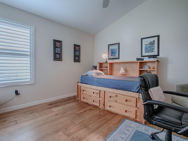 3136 Vandenberg Ct, The Villages, FL 32163 - bedroom featuring light wood finished floors, vaulted ceiling, baseboards, and ceiling fan