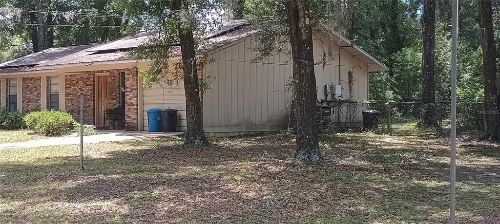 11820 N Par Ter, Dunnellon, FL 34434 - view of property exterior featuring fence and central AC