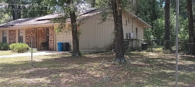 11820 N Par Ter, Dunnellon, FL 34434 - view of property exterior featuring fence and central AC