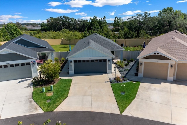 4451 Elijah Loop, The Villages, FL 32163 - view of front facade with a shingled roof and concrete driveway