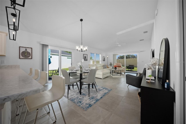 4451 Elijah Loop, The Villages, FL 32163 - dining room with plenty of natural light, a chandelier, and ceiling fan