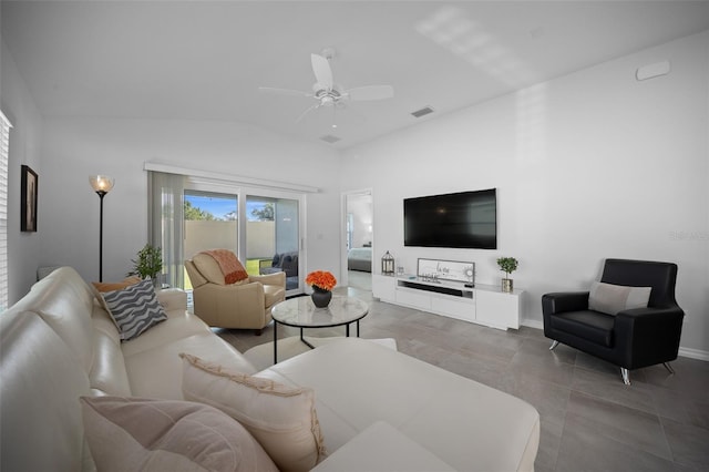 4451 Elijah Loop, The Villages, FL 32163 - tiled living room featuring lofted ceiling, a ceiling fan, and baseboards