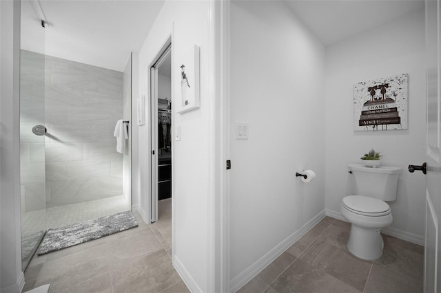 4451 Elijah Loop, The Villages, FL 32163 - bathroom featuring toilet, walk in shower, tile patterned floors, and baseboards