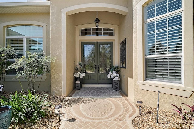 2204 Baypoint Way, The Villages, FL 32162 - doorway to property with french doors and stucco siding