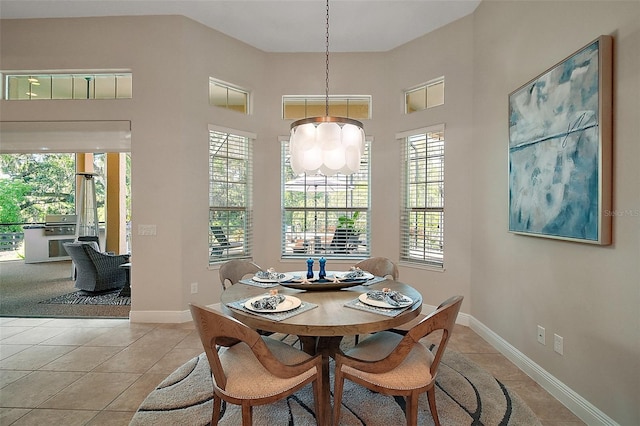 2204 Baypoint Way, The Villages, FL 32162 - dining space with light tile patterned floors, plenty of natural light, a chandelier, baseboards, and a towering ceiling