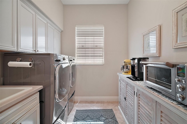 2204 Baypoint Way, The Villages, FL 32162 - laundry area with independent washer and dryer, light tile patterned floors, and baseboards