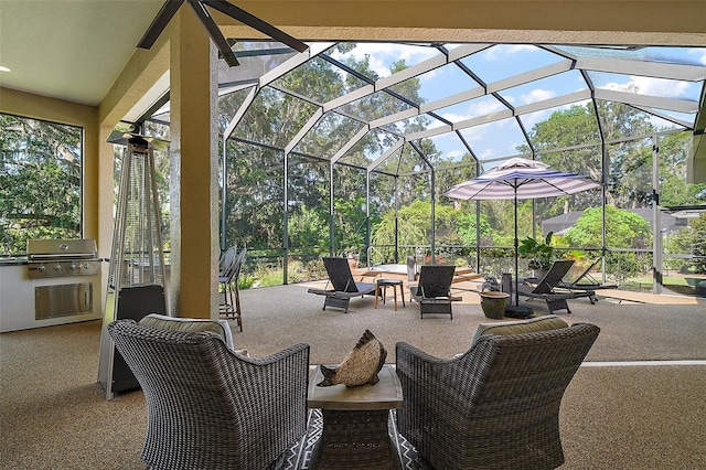 2204 Baypoint Way, The Villages, FL 32162 - view of patio featuring grilling area, exterior kitchen, glass enclosure, and outdoor lounge area