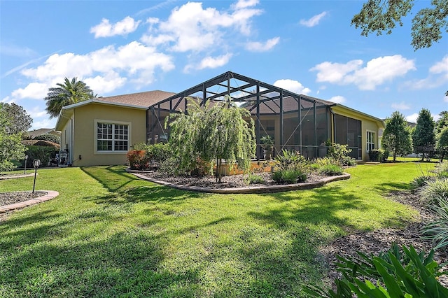 2204 Baypoint Way, The Villages, FL 32162 - back of property featuring a yard, stucco siding, and a lanai