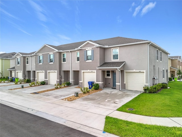 1042 Lido Dr, Howey In The Hills, FL 34737 - view of front facade featuring a garage, stucco siding, driveway, a residential view, and a front lawn