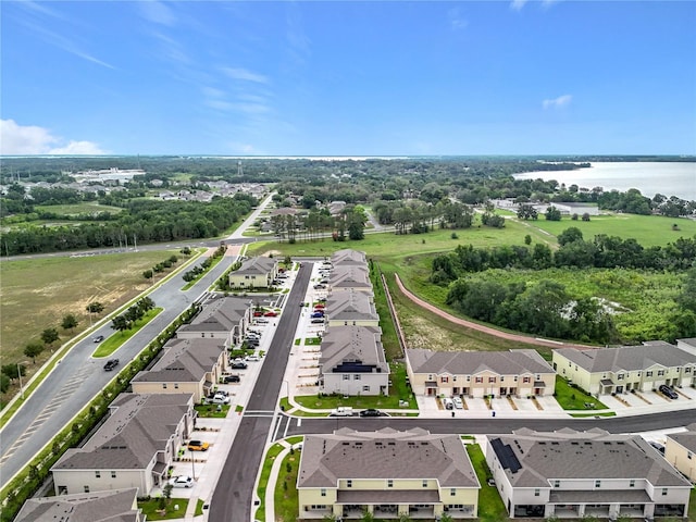 1042 Lido Dr, Howey In The Hills, FL 34737 - aerial perspective of suburban area with a nearby body of water and a tree filled landscape