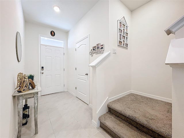 1042 Lido Dr, Howey In The Hills, FL 34737 - entryway featuring baseboards and light tile patterned floors
