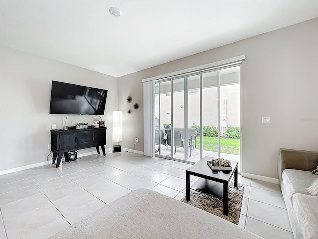1042 Lido Dr, Howey In The Hills, FL 34737 - living room featuring light tile patterned flooring and baseboards