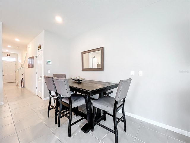 1042 Lido Dr, Howey In The Hills, FL 34737 - dining area with baseboards, light tile patterned flooring, and recessed lighting