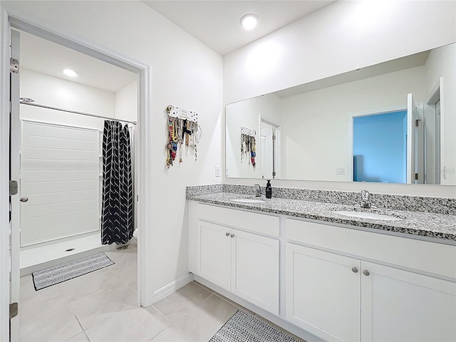 1042 Lido Dr, Howey In The Hills, FL 34737 - bathroom with double vanity, a shower with curtain, baseboards, and recessed lighting