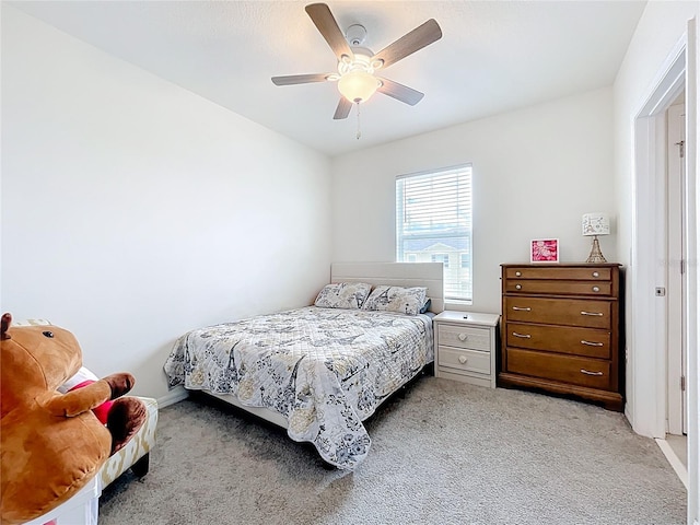 1042 Lido Dr, Howey In The Hills, FL 34737 - bedroom featuring light carpet, a ceiling fan, and baseboards