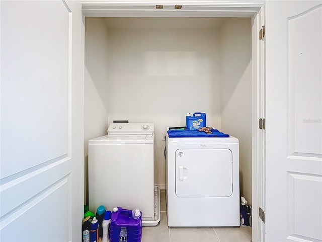 1042 Lido Dr, Howey In The Hills, FL 34737 - laundry area with separate washer and dryer and light tile patterned floors
