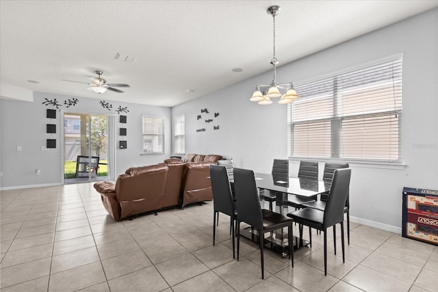 4869 Grassendale Ter, Sanford, FL 32771 - dining area featuring a chandelier, light tile patterned floors, a ceiling fan, and baseboards