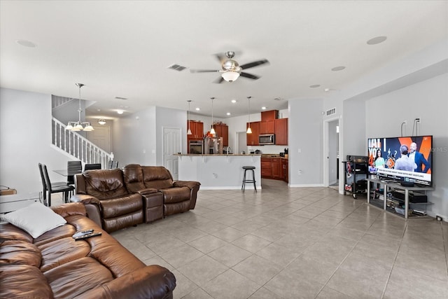4869 Grassendale Ter, Sanford, FL 32771 - living room with stairway, light tile patterned floors, ceiling fan, and baseboards