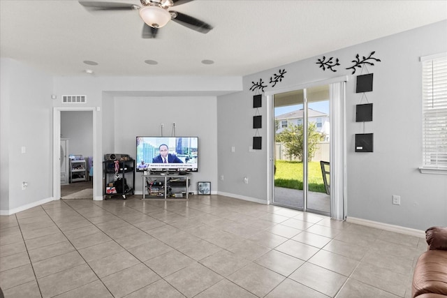4869 Grassendale Ter, Sanford, FL 32771 - living room with ceiling fan, light tile patterned floors, and baseboards
