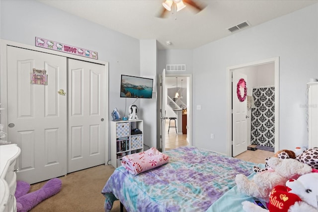 4869 Grassendale Ter, Sanford, FL 32771 - bedroom featuring a closet, a ceiling fan, ensuite bathroom, and light tile patterned flooring