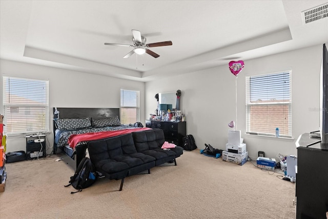 4869 Grassendale Ter, Sanford, FL 32771 - bedroom featuring a raised ceiling, carpet, and ceiling fan