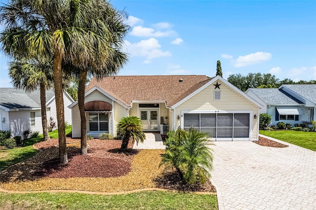 815 Cortez Ave, The Villages, FL 32159 - ranch-style house with a garage, roof with shingles, and driveway