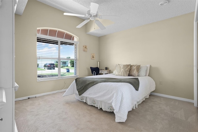 815 Cortez Ave, The Villages, FL 32159 - bedroom featuring carpet flooring, a textured ceiling, and ceiling fan