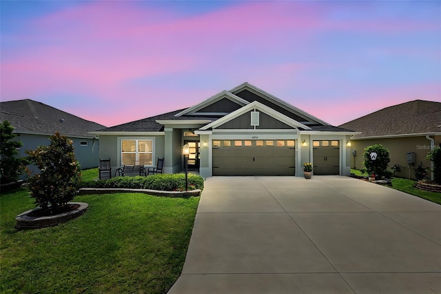 6243 Danielson Loop, The Villages, FL 32163 - single story home with a front lawn, a garage, driveway, and stucco siding